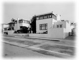 Black and white photo of the Horatio West apartments in Santa Monica, by Irving Gill. Street view.