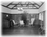 historic american homes black and white photos of a wood and stone cabin interior living room with fireplace